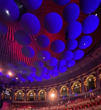 Image shows the mushrooms in the roof of the Royal Albert Hall, looking purple in the lighting