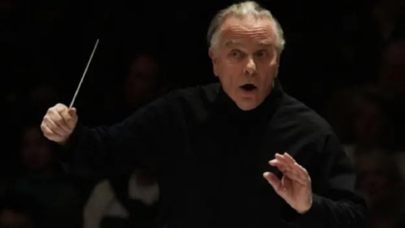 Image is of conductor Sir Mark Elder conducting